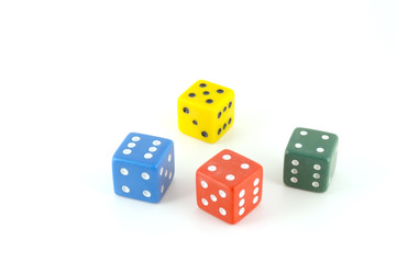 Four color dice over white