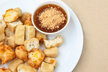 Fried tofu and corn fritter with sauce