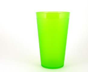 Green plastic cup over white