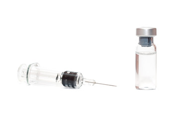 Syringe and vials on white
