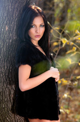woman standing near a tree