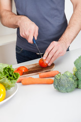 Young couple cooking at home