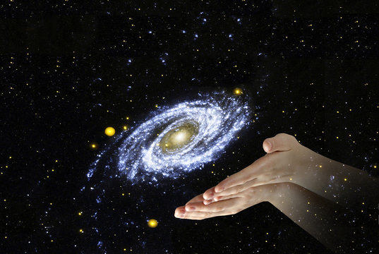 galaxy in palms.Elements of this image furnished by NASA