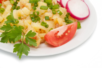 Potato with a garden radish and tomatoes