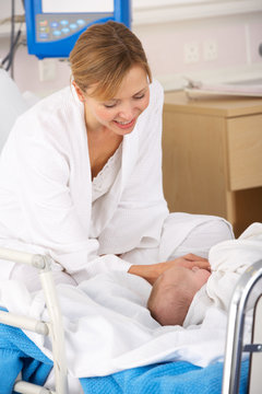 Mother in hospital with newborn baby
