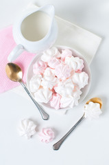 white and pink meringues