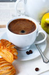 Breakfast, coffee and pastries closeup