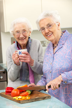 Senior Women Preparing Meal Together