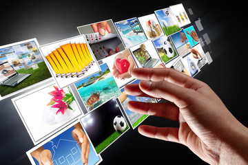 Hand reaching streaming multimedia from internet - obrazy, fototapety, plakaty