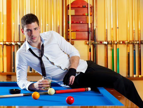 Billiard handsome player man drinking alcohol