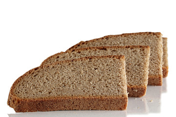 Three slices of rye bread on a white background.
