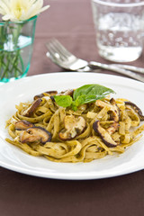 Fettuccine with mushroom in pesto sauce