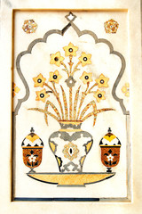 Details of polished marble surface is covered by stone inlay.