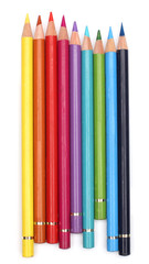 Color pencils over white background