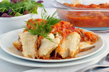 Baked fish in tomato sauce with vegetables