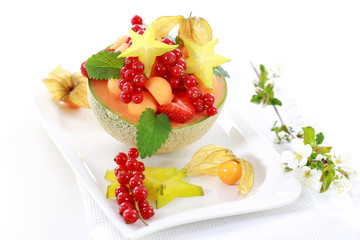 Fresh fruits served in melon bowl