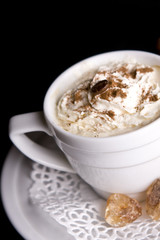Coffee background and white cup isolated in black