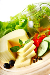 Cheese on a wooden plate