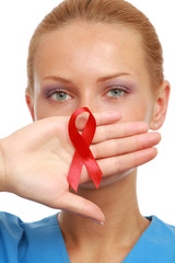 A young nurse with an aids ribbon