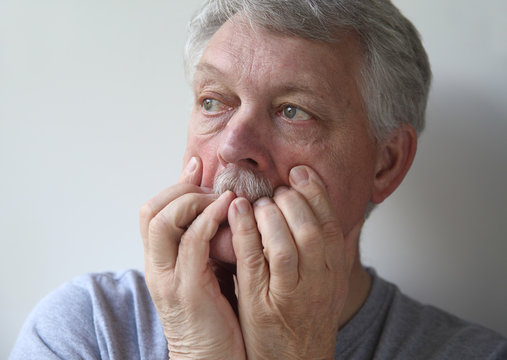 A Senior With An Anxious, Fearful Expression