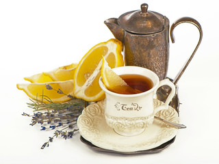 Teapot and tea  and lemon isolated on white background