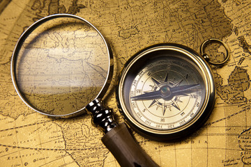 Fototapeta na wymiar Compass on old map