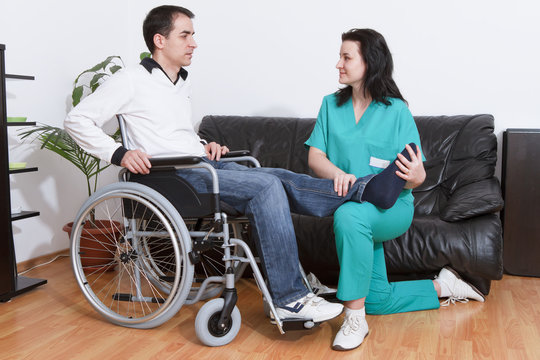 Physical therapist working with patient