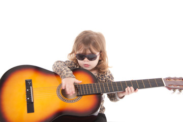 Fototapeta premium Child playing a guitar