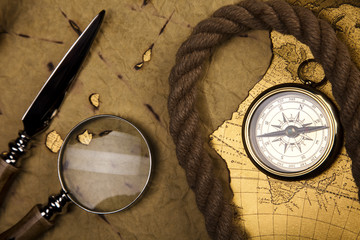 Obraz na płótnie Canvas Old navigation instrument, map and compass