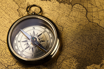 Fototapeta na wymiar Compass on the old map background