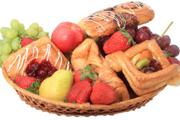 Basket with fruits and pastries.