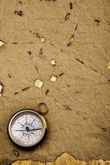 Old style compass and paper background