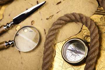 Fototapeta na wymiar Old navigation instrument, map compass