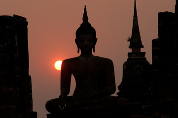 Silhouette of  Buddha in Sukhothai historical park in Thailand.