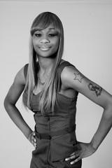 Black woman looking thouhtful with a smile