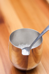 Stainless steel bowl of sugar