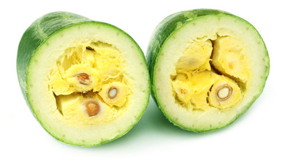 Sliced pointed gourds over white background