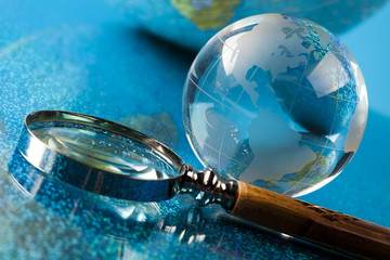 Globe and Magnifying glass