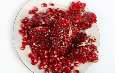 pomegranate seeds on a white background