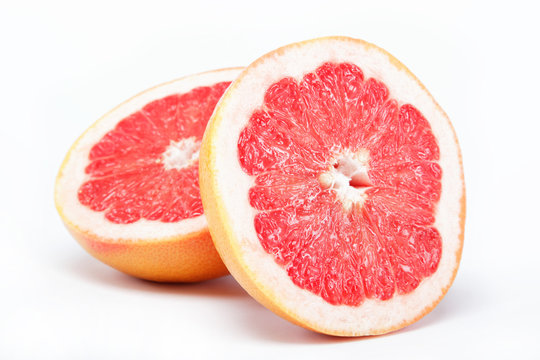 Fresh grapefruit on a white background.
