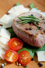 Cooked Beef on arugula and parmesan