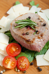 Cooked Beef on arugula and parmesan