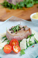 Cooked Beef on arugula and parmesan