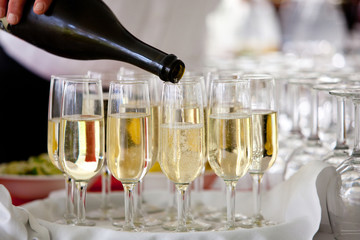 champagne pour into glasses