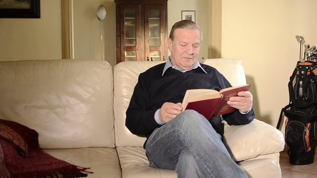 senior man reading a book