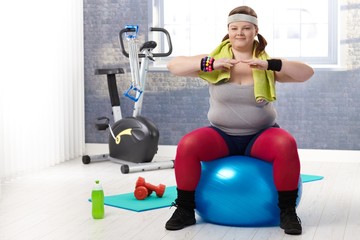 Fat woman doing gymnastics