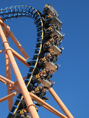 moving roller coaster with blue sky
