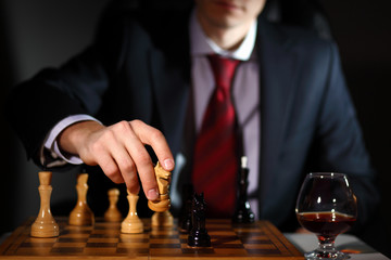 Businessman playing chess