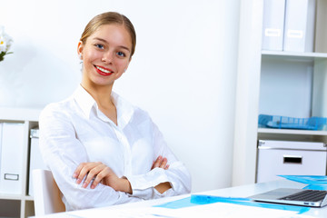 Young woman in business wear working in office