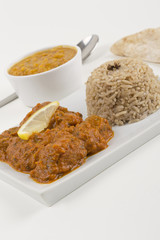 Indian Meat Madras served with pilau rice, tarka dahl & chapatis